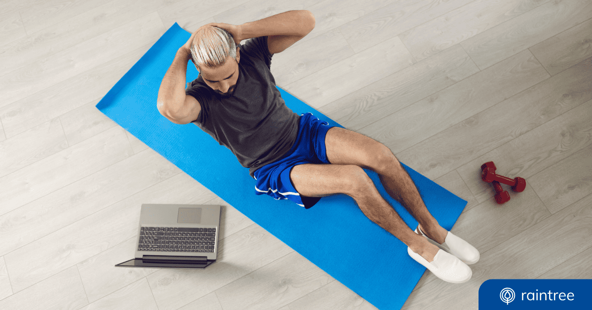 A Physical Therapy Patient Pictured From Above While Doing Abdominal Exercises And Facing A Laptop Screen. Illustrating The Topic Of Telehealth And Patient Engagement.