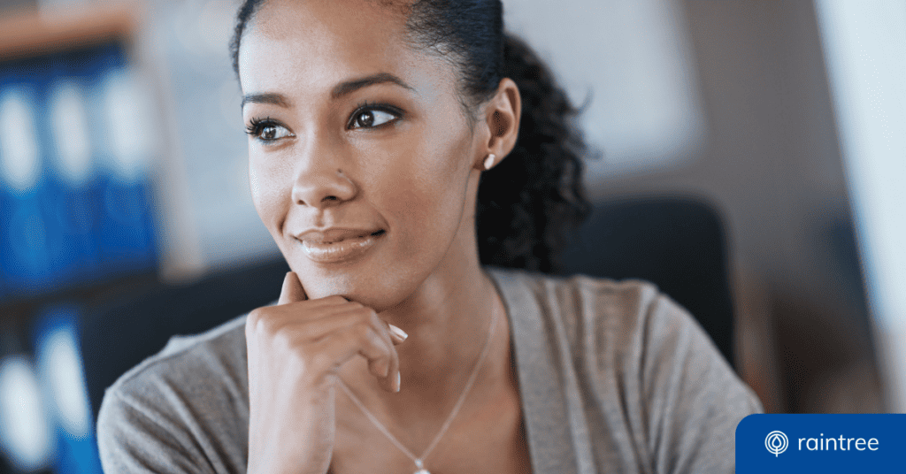 A rehabilitation practice financial manager smiles and looks off camera. Illustrating the topic: 'How to Streamline RCM Workflows"