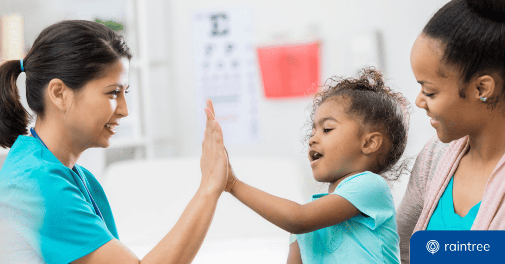 A Pediatric Patient Does A High-Five With Her Therapist, While Her Mom Looks And Smiles. Illustrating The Topic: &Quot;Pediatric Therapy Software For A Modern Practice.&Quot;