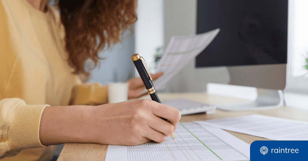 An RCM professional manually checks a paper document. Illustrating the benefits of automated revenue cycle management and billing tools.
