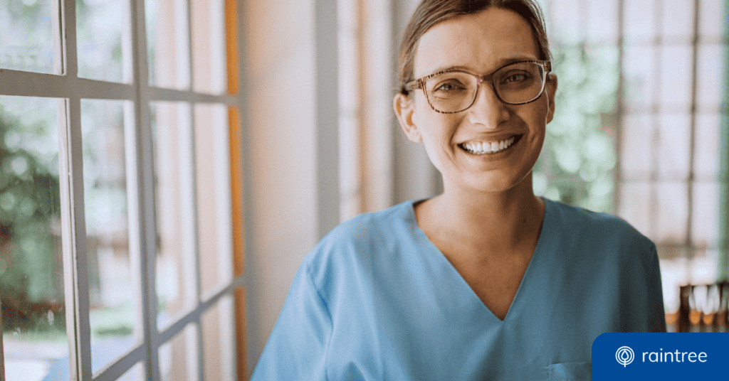 A physical therapist wearing scrubs and glasses smiles at the camera. Illustrating the topic du jour: "Patient Enagement Tools for PT, OT, and SLP"