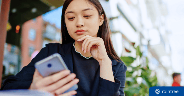A therapy patient looks down at her phone. Illustrating the topic of "Healthcare Engagement with SMS."