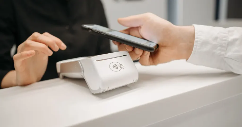 A header image showing a patient completing their point of service payment with a contactless card reader. The caption reads: "Collecting Patient Payments: Tips and Tools"