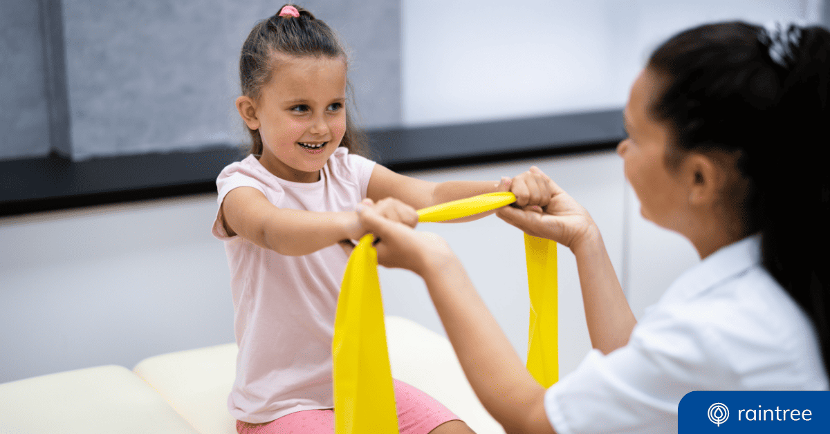 A Young Patient And A Physical Therapist Hold An Elastic Band During A Physical Therapy Session. Illustrating The Topic: Finding The Right Software For Pediatric Therapy And Aba Practices