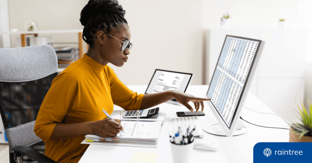 A medical billing specialist looks at a screen, which displays a complex spreadsheet. Illustrating the need for streamlined medical billing software in PT and rehabilitation therapy practices.