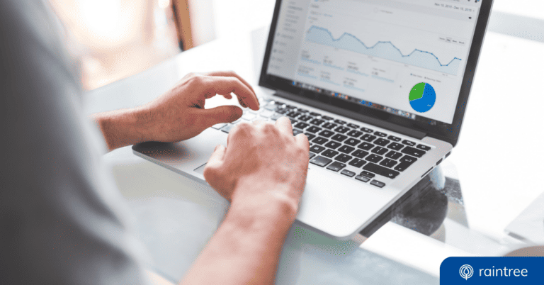 A header image showing a revenue cycle management professional using a computer to look at financial reports after Medicare reimbursement cuts.