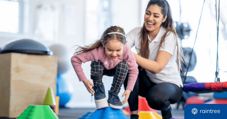 A pediatric therapist works with a young patient, who balances on a blue block. Illustrating the topic: "Expert Tips for Leading a Pediatric Therapy Practice."