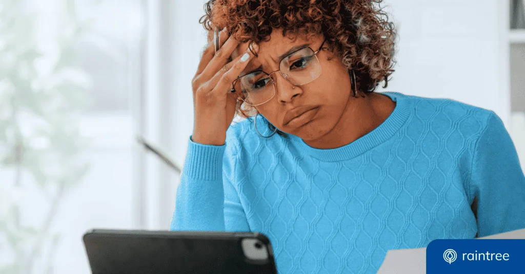 A Concerned Woman In A Blue Sweater Uses A Tablet, Illustrating The Topic Of &Quot;Medical Billing And Coding Compliance.&Quot;