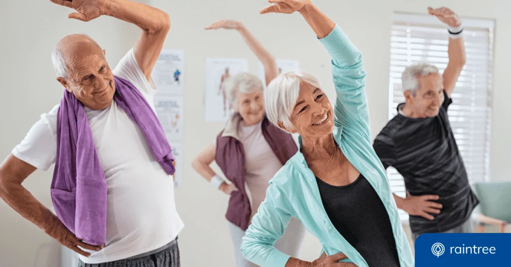 A Group Of Medicare Patients Stretch Their Arms Above Their Heads In A Physical Therapy Clinic, Illustrating The Topic Of &Quot;Physical Therapy Billing Examples.&Quot;