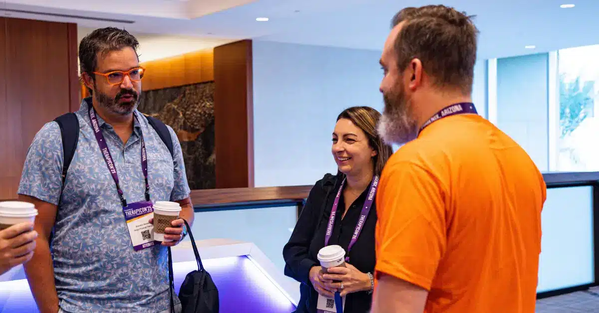 Blog 1 How Rehab Therapy Teams Maximize Therapycon Conference Roi By Attending As A Team. Image: Three Therapycon Attendees Smiling And Standing In A Group.
